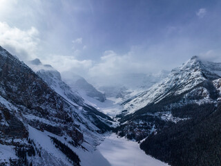 aerial view of mountain peaks at frozen  luise lake