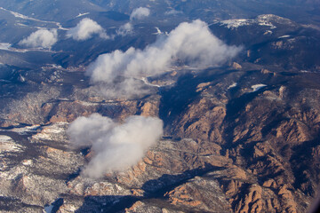 Fototapeta premium Aerial Mountain views of the colorado rocky mountains and a stream flowing through a valley.