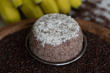 Poongar rice puttu. Steamed rice cake with poongar rice flour and freshly grated coconut. A healthy breakfast dish with Poongar rice.