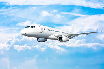 Fototapeta na wymiar White passenger airplane fly in the picturesque sky
