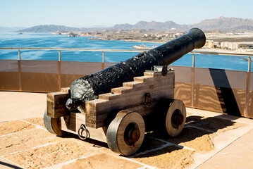 Fototapeta na wymiar cannon on the background of the sea and mountains in oman