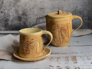 Unique ceramics. Thread-like pattern.Inside the glaze. Cup and saucer, jug.