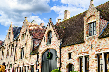 Fototapeta premium Bruges, Belgium sunset view of the medieval buildings that are crossed by the canals of the city. historical. 