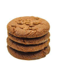 Stack of dark chocolate chip biscuits isolated on white background
