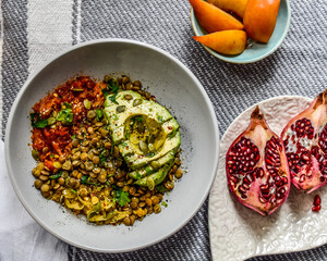 Vegan Avocado Lentil Bowl colorful flat lay, top down composition, eat with your eyes with pomegranate