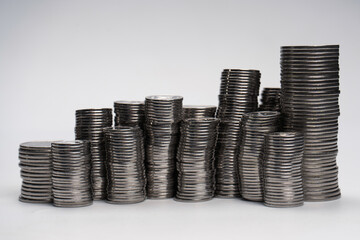 Pile of coins isolated on a white background.