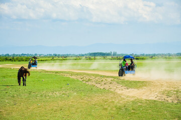 Bandar Anzali, Iran - 10th june, 2022: iranian tourist enjoy ride in nature in North Iran, Gilan...