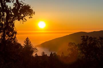 Sunset over the pacific at Big Sur. Camping on a mountain ridge.
