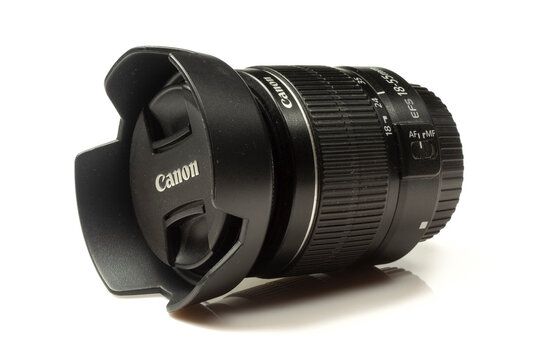 Canon 18-55mm 3.5-5.6 kit lens with lens hood isolated on white background