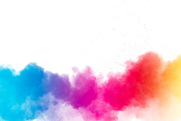 Multi colour powder explosion on white background. Launched colourful dust particles splashing.