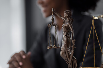 African American Lawyer woman working at office desk, concepts of law and legal services, law contract.