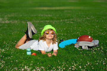Happy childhood. Kids playing outdoors in summer park. Freedom and carefree. Happy childhood. Relaxing kid in green field during summer.