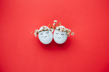 Perfect colorful handmade easter eggs on red background. The minimal concept. Top view. Card with a...