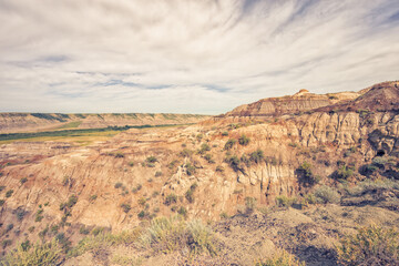 Landscape of the Badlands of Drumheller with a textured sky