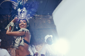 Shes a scintillating samba queen. a beautiful samba dancer performing in a carnival.