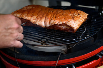 Meat preparation for BBQ.Pork belly  is a boneless and fatty cut of meat from the belly of a pig. Pork belly is particularly popular in Hispanic, Chinese, Danish, Norwegian, Korean, Thai and Filipino