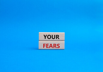 Your fears symbol. Wooden blocks with words Your fears. Beautiful blue background. Business and Your fears concept. Copy space.