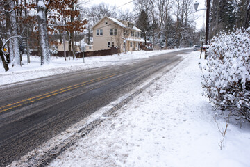 county road covered with snow in winter