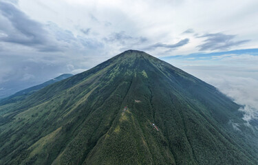 Fototapeta premium Aerial view of Mount Sindoro in Indonesia with noise cloud. High quality photo. Selective focus. 