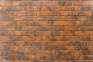 Texture of a wall made of new brown bricks.