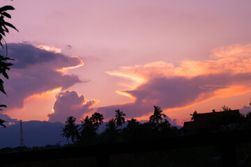 Beautiful purple sunset with mountains in winter.