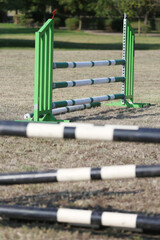 Show jumping poles obstacles, barriers, waiting for riders - obrazy, fototapety, plakaty