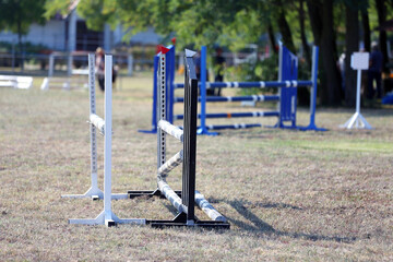 Show jumping poles obstacles, barriers, waiting for riders