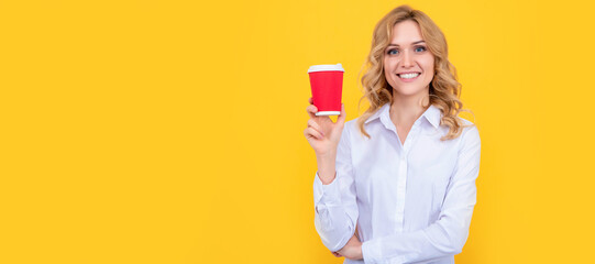 happy blonde woman with coffee cup on yellow background. Woman isolated face portrait, banner with mock up copy space.