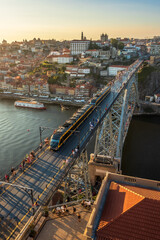View over the D. Lu&iacute;s bridge with the city of Porto in the background, at the end of the day in summer.