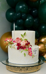 white party cake with flowers
