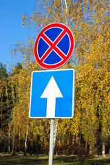 International traffic signs 'No parking stopping' and 'One Way Traffic'