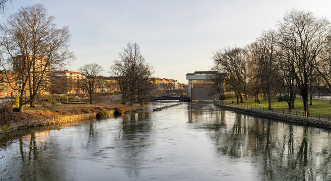 Trollhattan Midtown waterfront Old-fashioned Canal near Gota Alv river and hydroelectric Dam in Sweden during Late evening.
