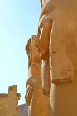 Obraz na płótnie Canvas Side Profile of Two Egyptian Statues 