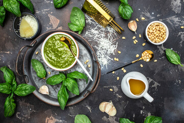 Obraz na płótnie Canvas Pesto sauce cooking Basil, olive oil, parmesan, garlic, pine nuts. banner, menu, recipe place for text, top view