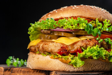 home made tasty burger cheese slice, tomato, onion,lettuce, mayonnaise, white bun, Fat unhealthy food. banner, menu, recipe place for text