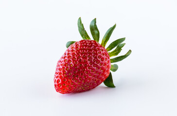 A single isolated ripe strawberry against a white background.