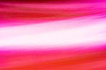 Abstract background with red and pink diagonal stripes.