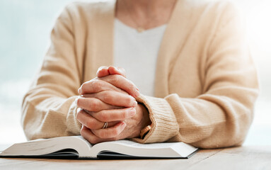 Bible, praying or hands of old woman in prayer reading book for holy worship, support or hope in...