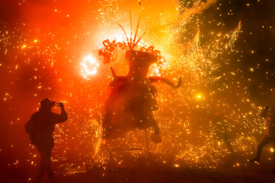 A handmade bull in the middle of a firecrackers burst in an annual celebration in Tultepec, Mexico.