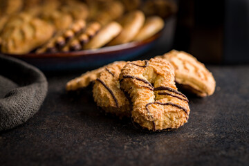 Assorted various cookies. Sweet biscuits  on black table.