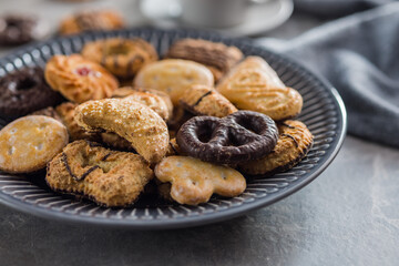 Assorted various cookies. Sweet biscuits on plate.