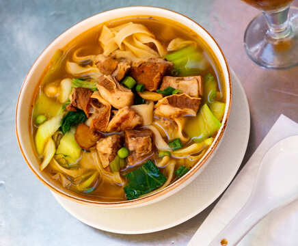 Traditional chinese soup with beef and noodles