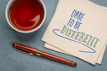 dare to be different - inspirational note, handwriting on a napkin, nonconformism, career, education and personal development concept - obrazy, fototapety, plakaty