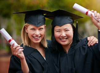Your wings already exist, all youve to do is fly. two college graduates holding their diplomas.