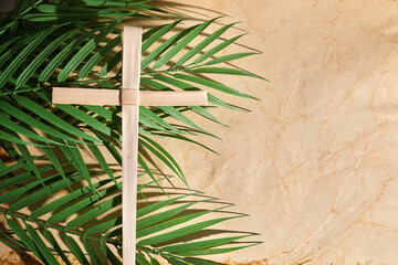 Fototapeta na wymiar Palm sunday background. Cross and palm on vintage background.
