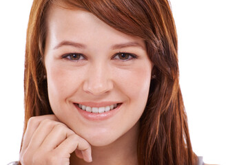 Just being herself. Cropped closeup portrait of a pretty redhead against a white background.