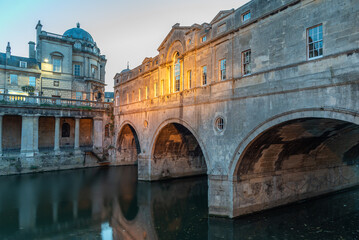 Pulteny Bridge is an arch bridge with shops on its side in Bath city UK