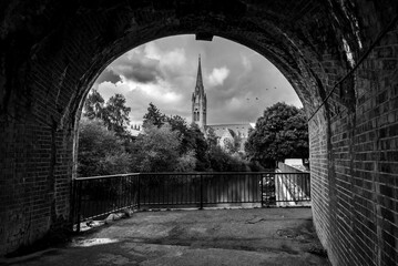 Black & White image of St Johns The Evangelist Church and its view through  an arch, Bath city, UK