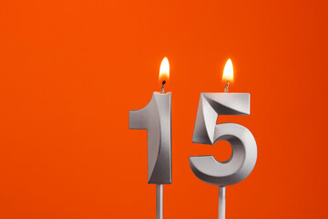 Candle number 15 - Birthday in orange background