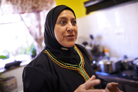 Ive got a recipe youll love. a mature muslim woman in her kitchen.